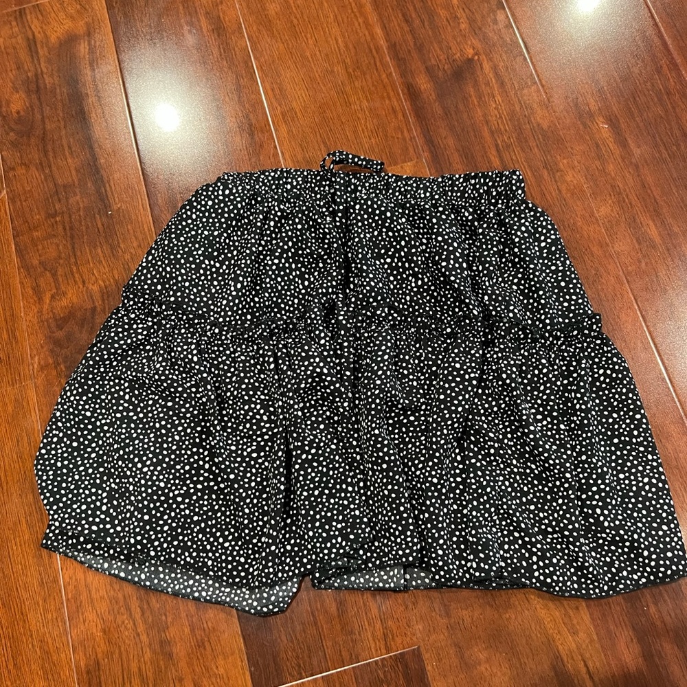 black skirt with white polka dots